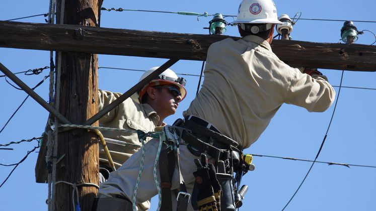 Linemen Working on Pole