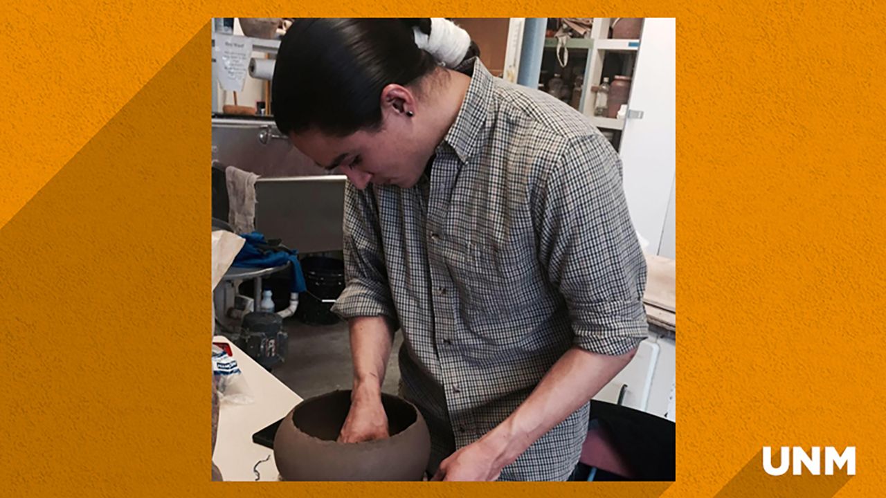 Tso working on pottery