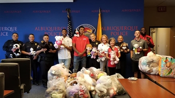 Hundreds of donated bears to UNM BeKind processed at the Albuquerque Police Department 