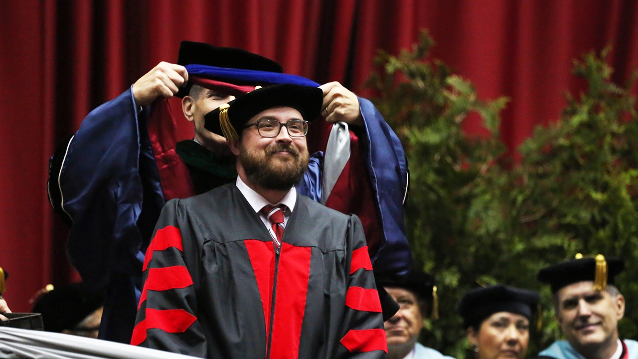 Hooded graduate