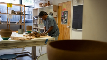 Native American artist teaches traditional methods of making Pueblo pottery
