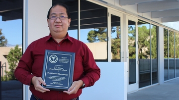 Engineering professor presents research and receives award during international symposium