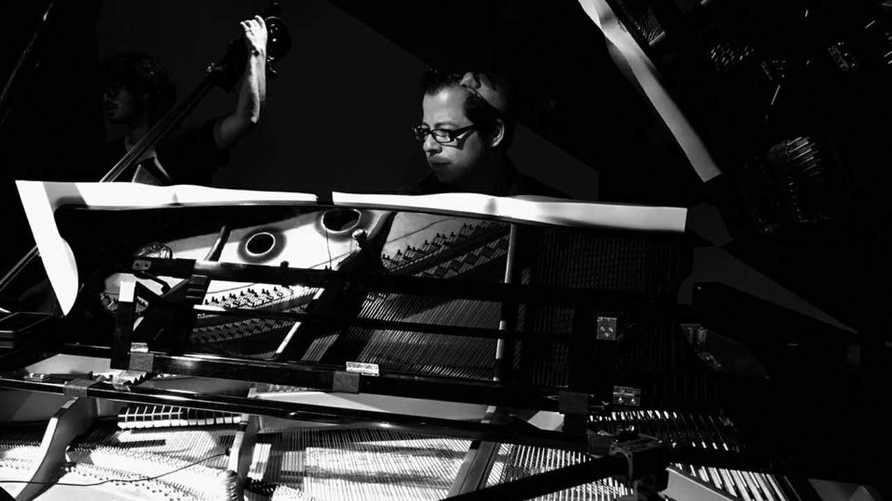 At the piano