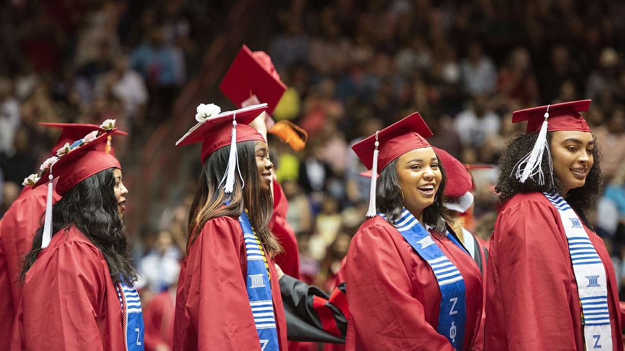 Graduates wait in line to cross the dais 