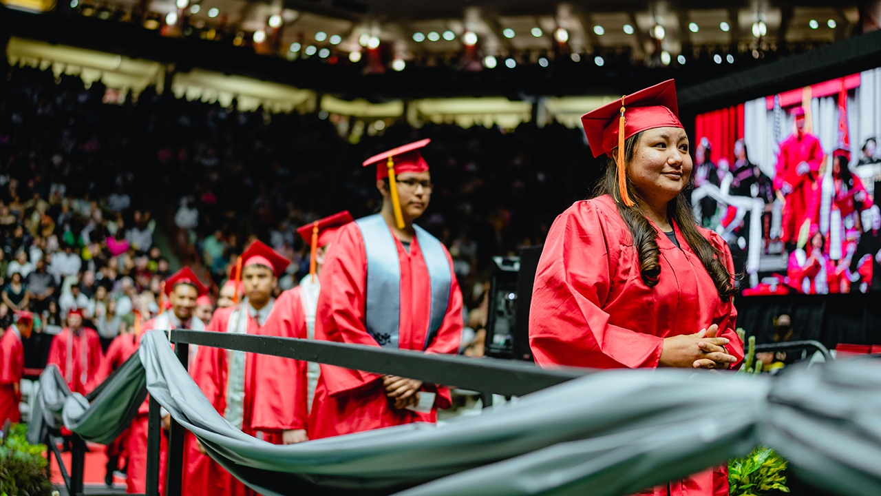 Graduates in line to receive diplomas.