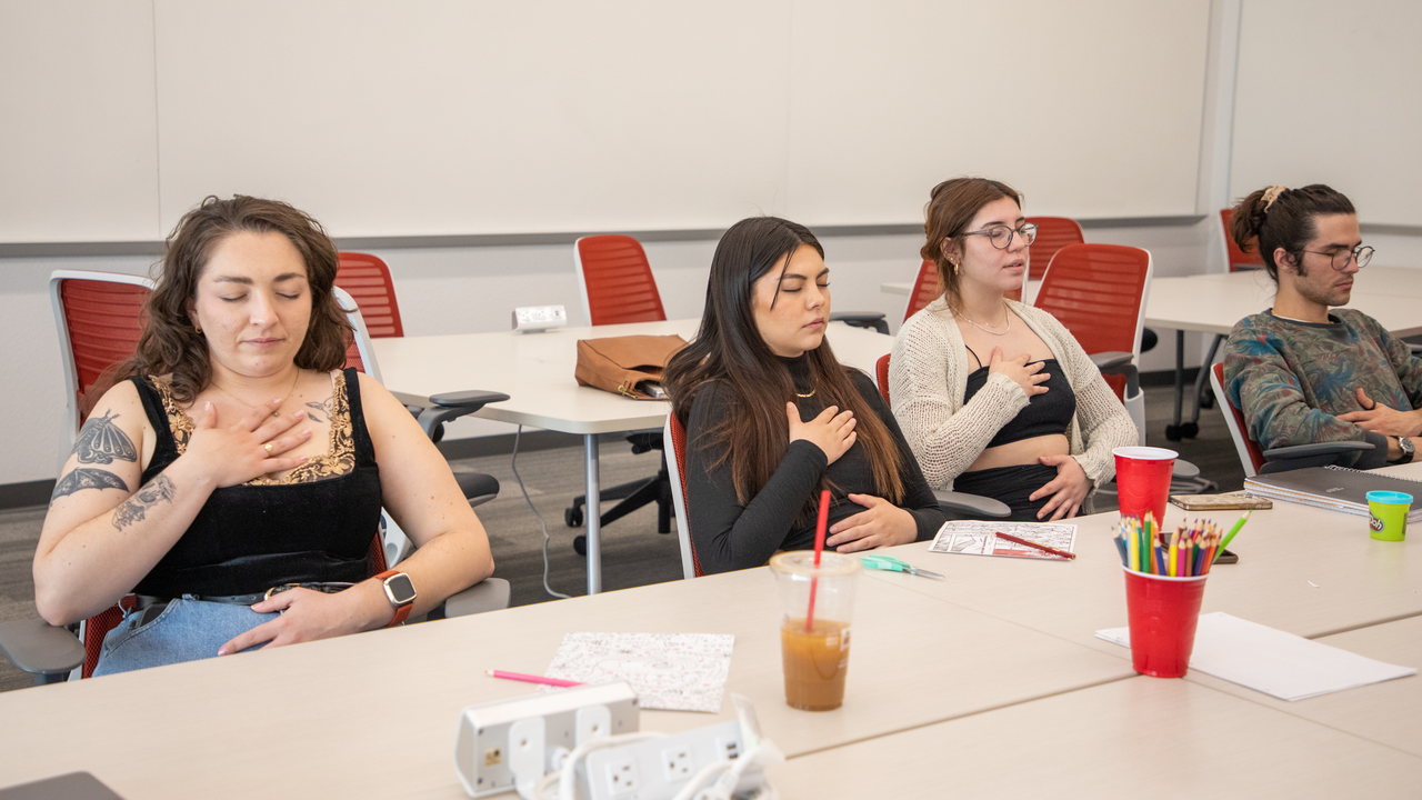 Students participate in breathing exercises.