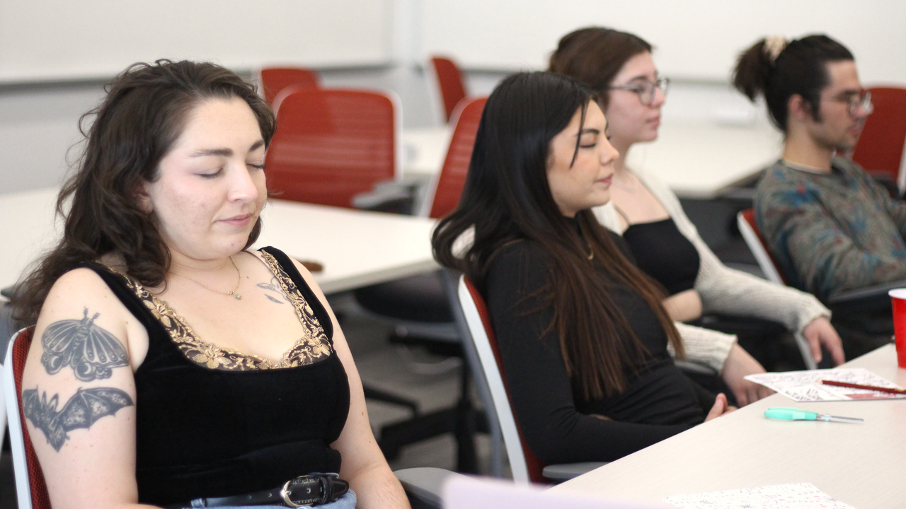 Students participate in breathing exercises.