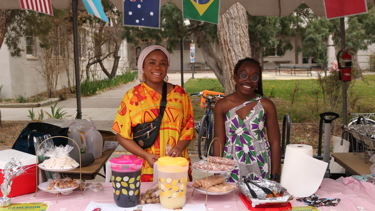 Johanna Bode and Shannon Essomba sell Cameroonian sweets.
