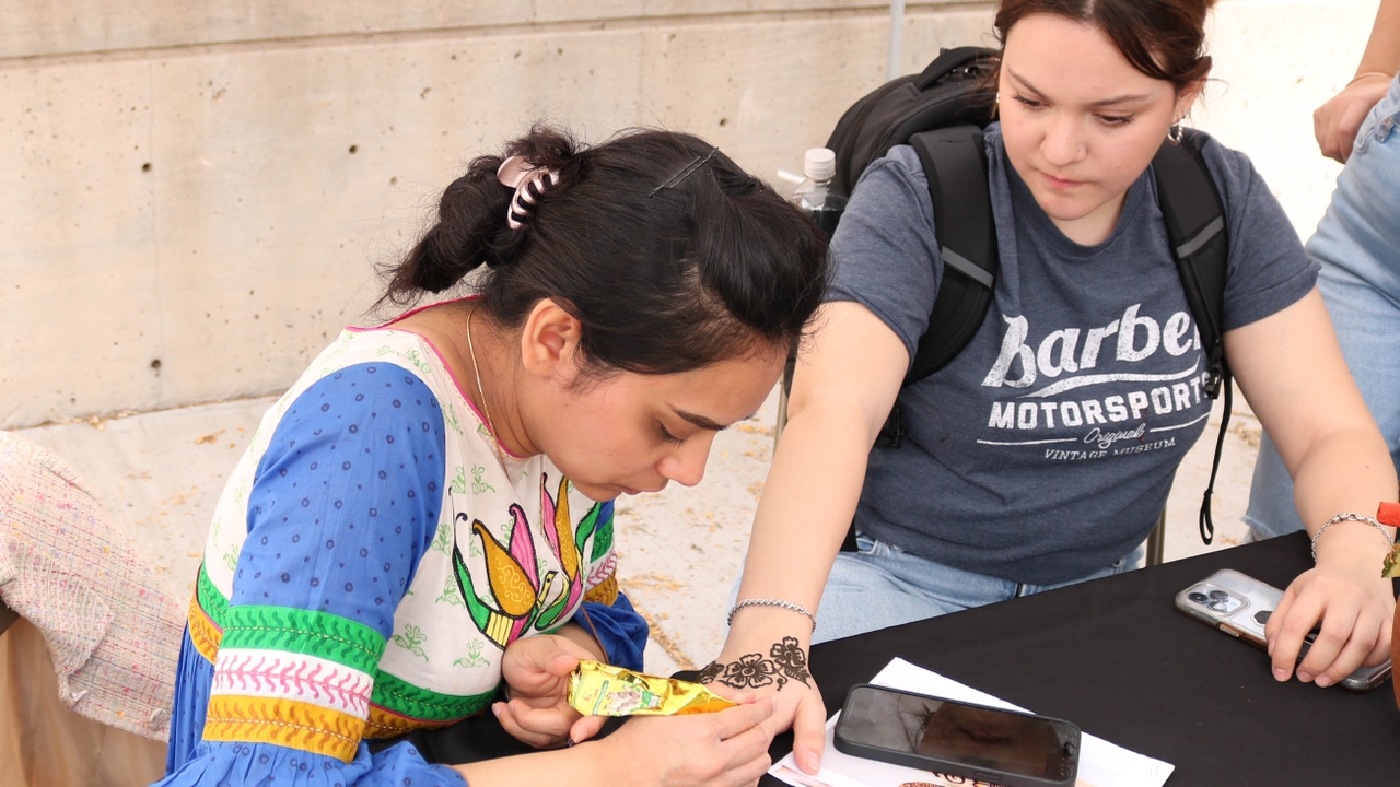 A student gets henna at the International Festival.