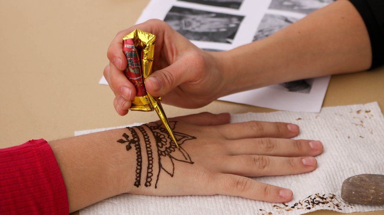 Henna artists drew body art at the festival.