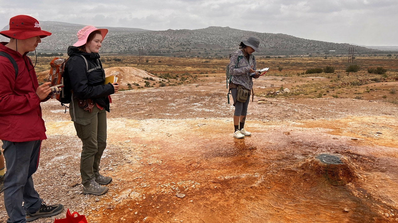 Field group taking notes at bubbling springs near San Ysidro, NM.