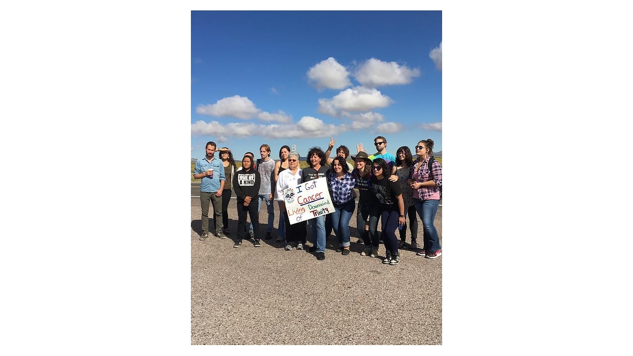 A group photo of the class on a Trinity Site field trip with community members in 2016.