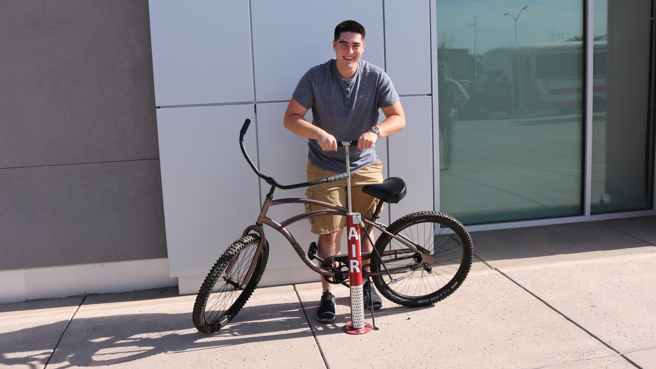 Nicolas Estrada with UNM's new bike pump