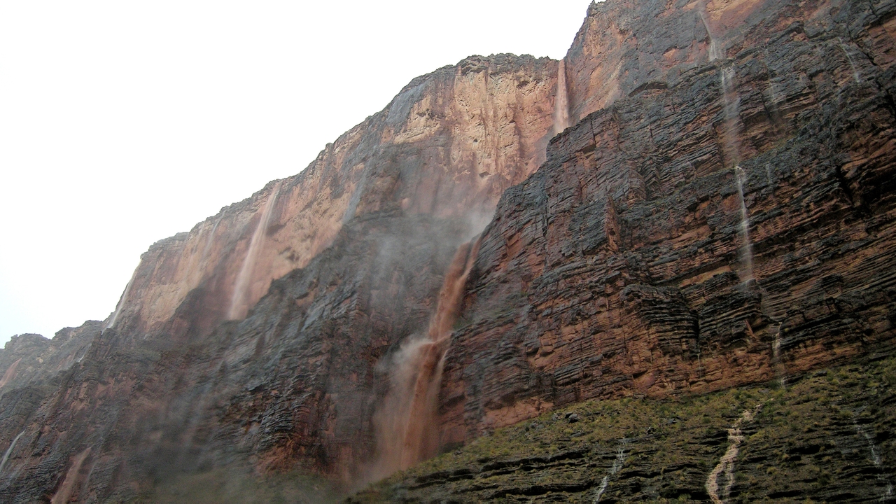 Monsoonal rains leave behind short-lived waterfalls after a downpour. 