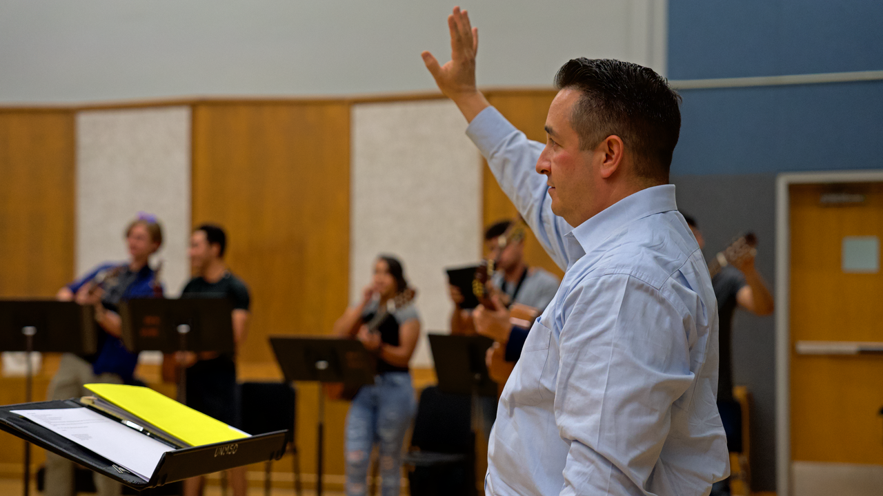 Robert Lucero leads Mariachi Ensemble practice