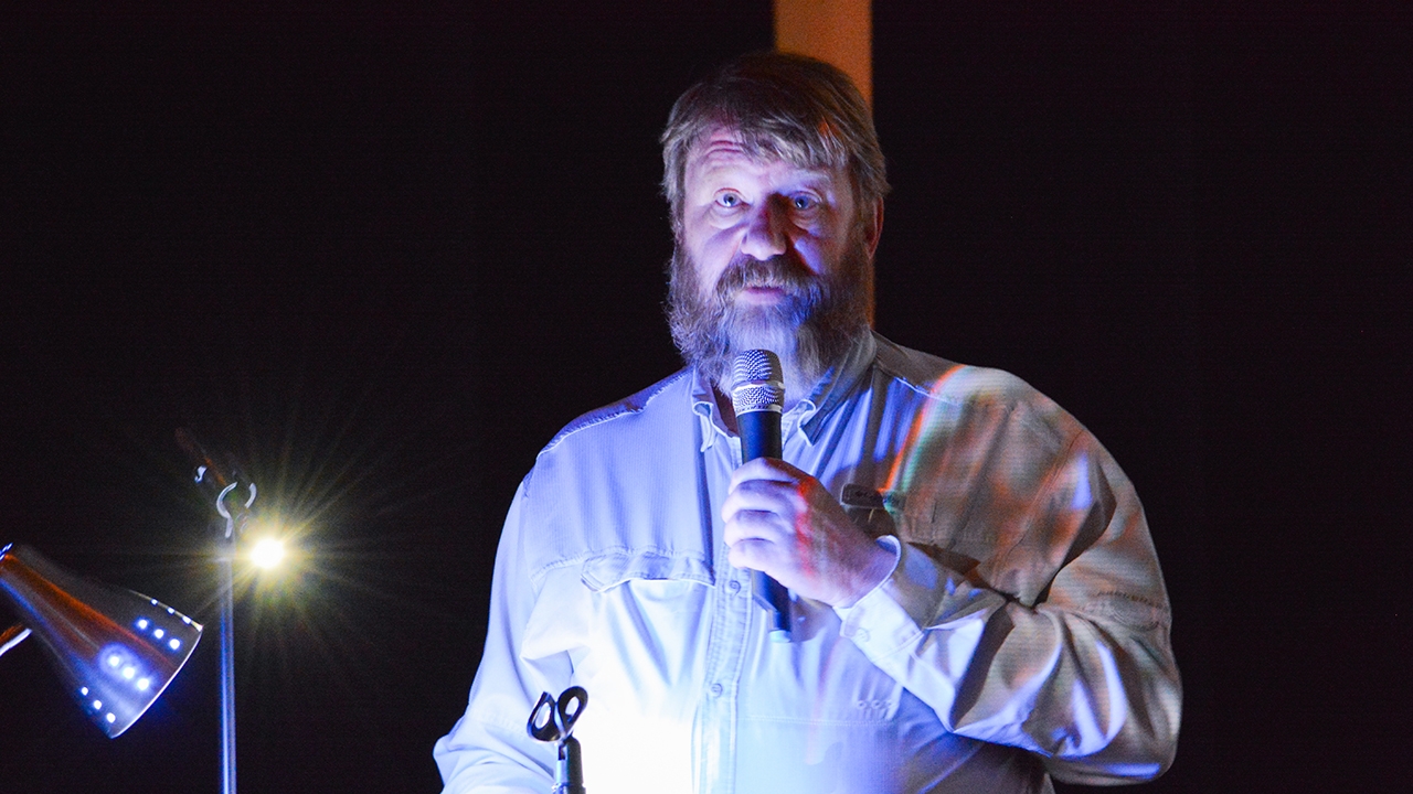 UNM-Gallup Professor Bruce Gjeltema delivers a presentation on Gallup’s history of migration at El Morro Theatre.