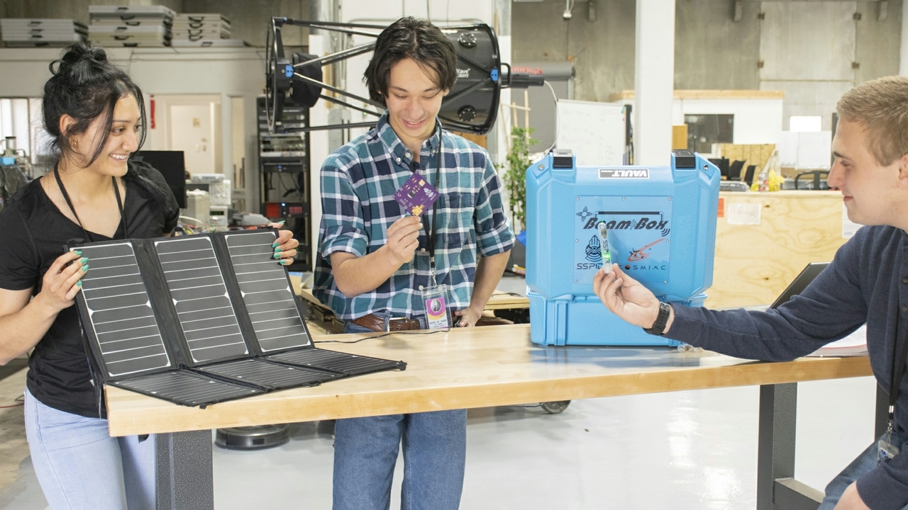 Students work on an outreach project within the broad area of space beaming.