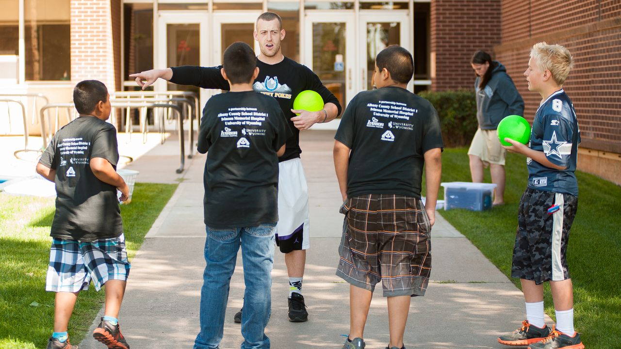 Future physical educator works with students