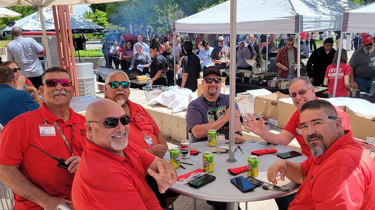 A group of staff enjoying the shade 