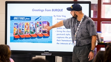 Angel Estrada explains school art project