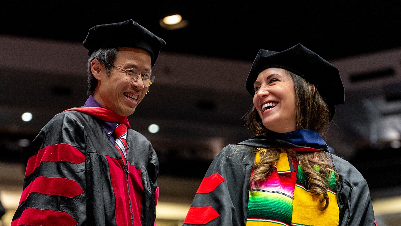 A just hooded graduate student 