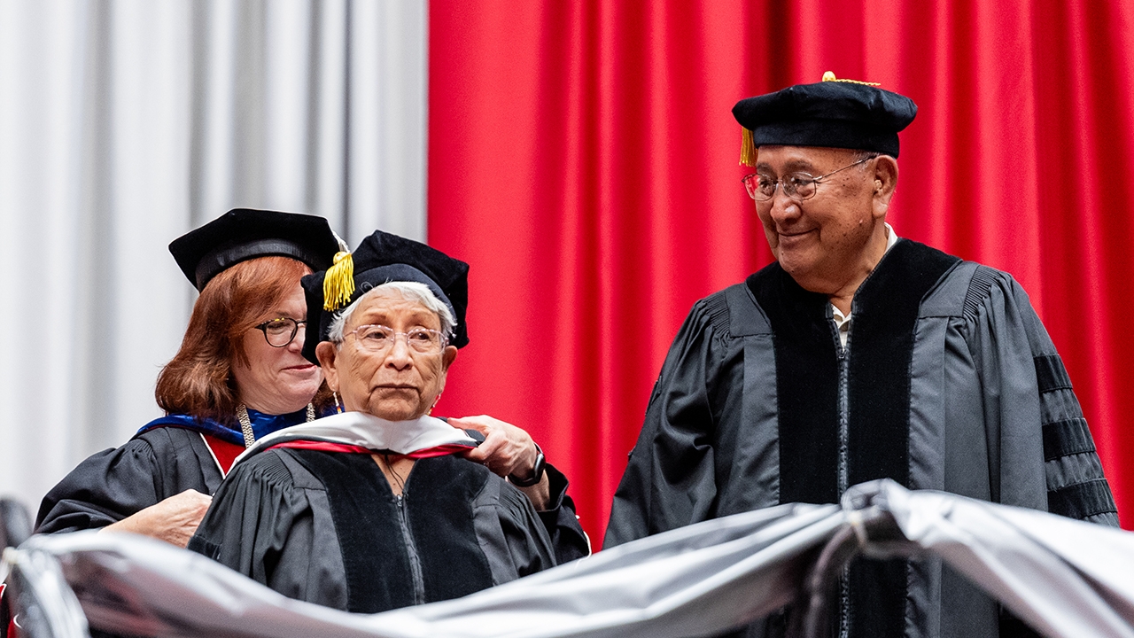 Roberta Eileen Velarde Serafin is hooded with