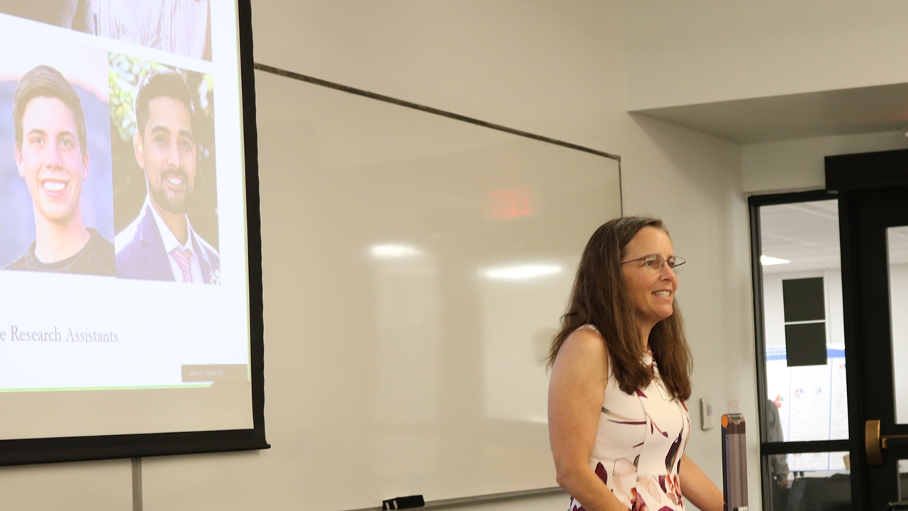 Jennifer Malat, dean, College of Arts and Sciences, gives
