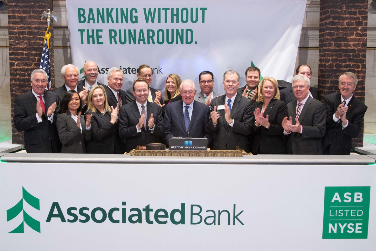Associated Bank knocks down notion of banking barriers, celebrates transfer to NYSE with The Opening Bell