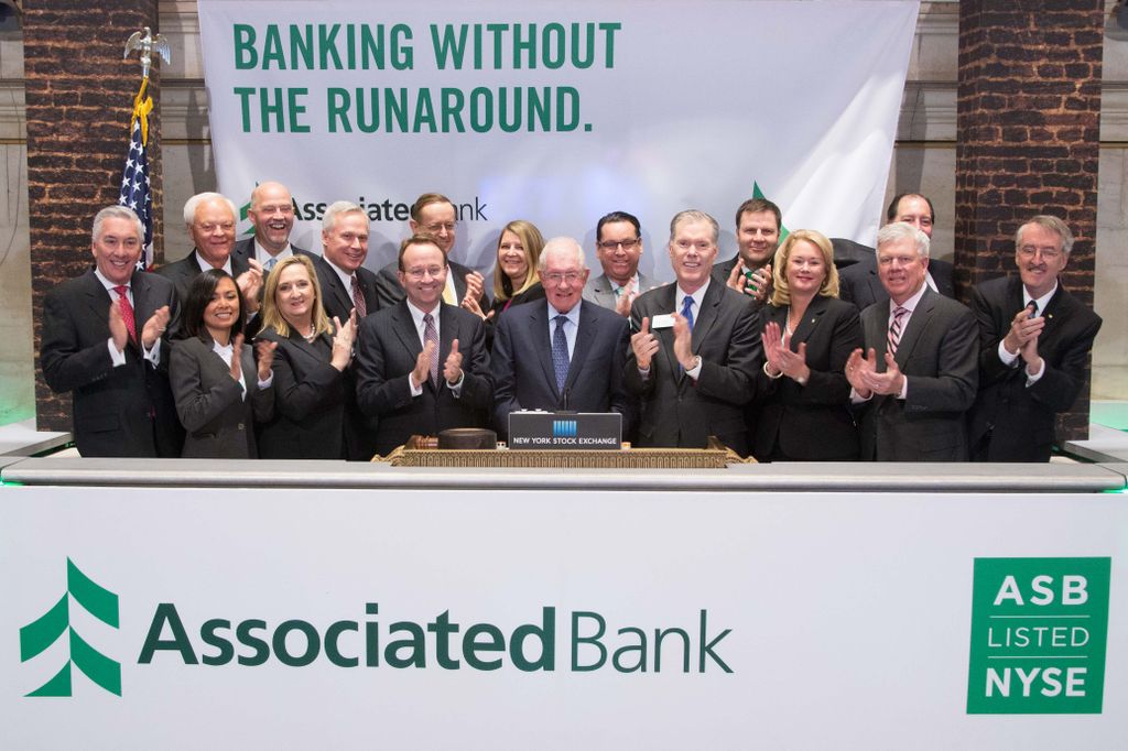 Associated Bank knocks down notion of banking barriers, celebrates transfer to NYSE with The Opening Bell