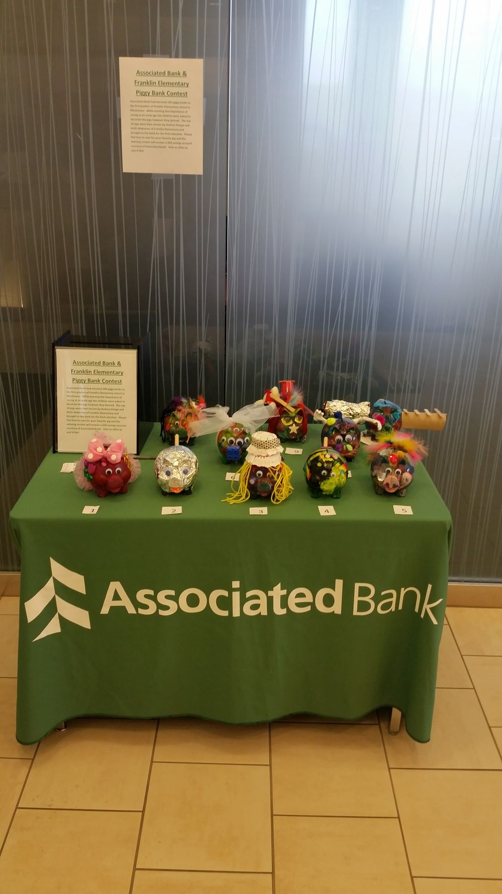 Associated Bank’s Bret J. Kuether volunteers to help teach financial literacy to children