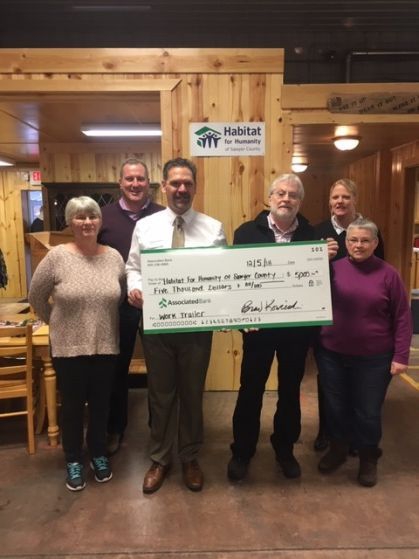 Associated Bank colleagues present a check to Habitat for Humanity of Sawyer County. 