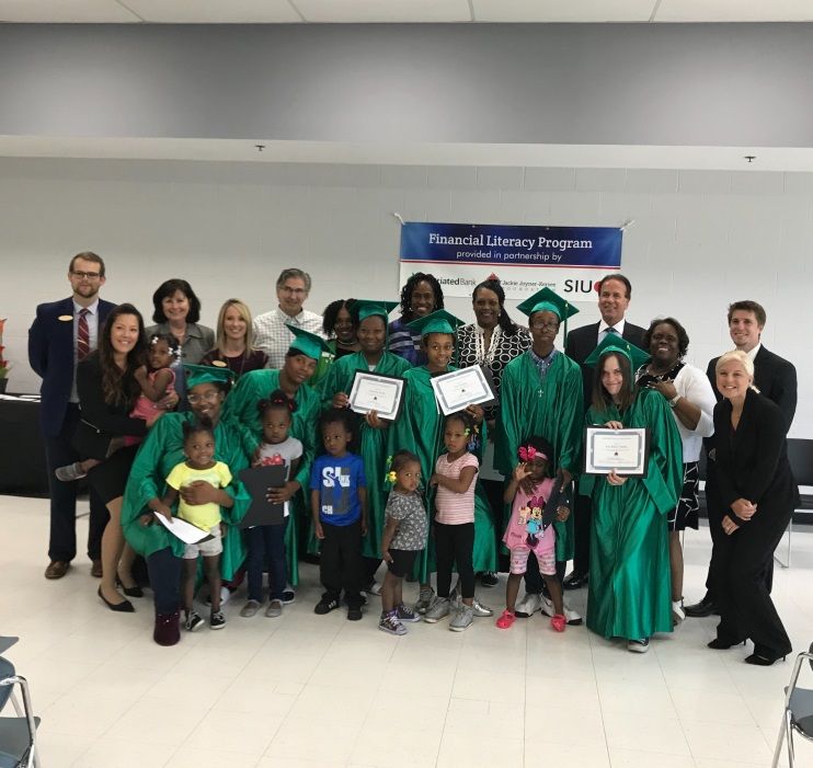 Graduates and program volunteers at the graduation ceremony on May 23 at the Jackie Joyner-Kersee Center.