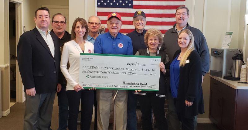 Stars and Stripes Honor Flight receives donation from Associated Bank Veterans Appreciation Event in Grafton