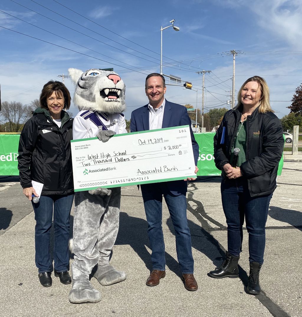 From left to right: Dr. Michelle Langenfeld, Green Bay Area Public School district; Christopher Piotrowski, Associated Bank; and Patti Habeck, Feeding America Eastern Wisconsin presented West High School with a $2,000 grant for the school’s music program.