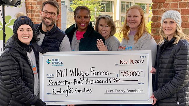 Duke Energy and Mill Village Farms join volunteers in Greenville for ‘Yam Jam’ to bag sweet potatoes for Thanksgiving food boxes
