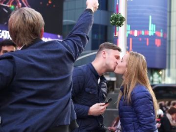 Spreading Holiday Joy with Coffee, Donuts and…. Mistletoe!