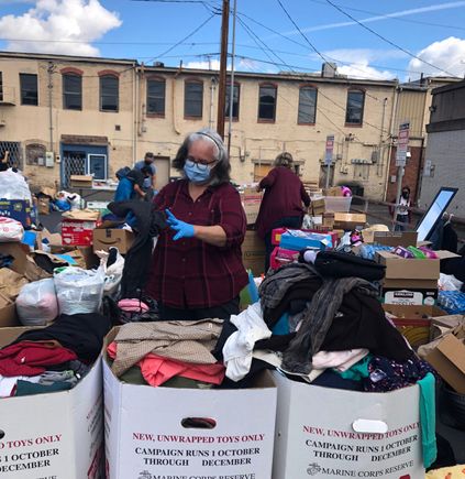 Cathy sorting clothes