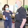 Marian Dale, M.D., M.C.R., works with patient