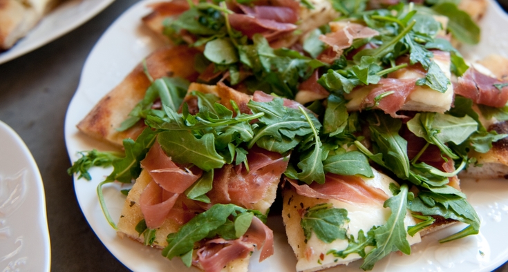 Close-Up Of Fresh Flatbread Prosciutto Pizza Served In Plate