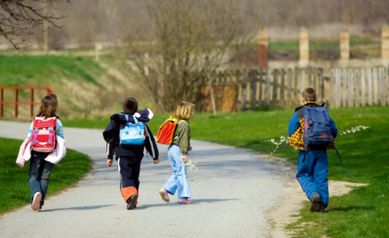 Two boys and two girls going to school