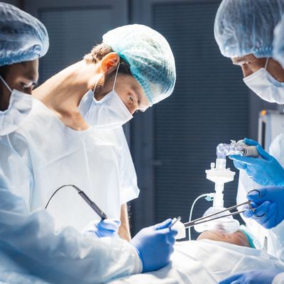 Diverse Team of surgeon, assistants and nurses making invasive surgery