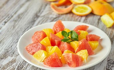 Citrus Salad on Mango Puree with Shaved Chocolate and Toasted Almonds