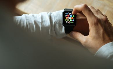man-looking-at-apple-watch