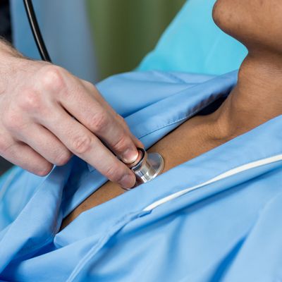 Doctor or nurse using stethoscope checking to patient.