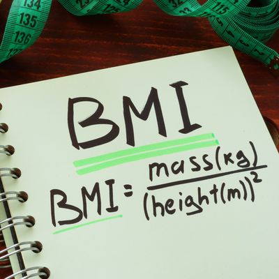 BMI body mass index written on a notepad sheet.