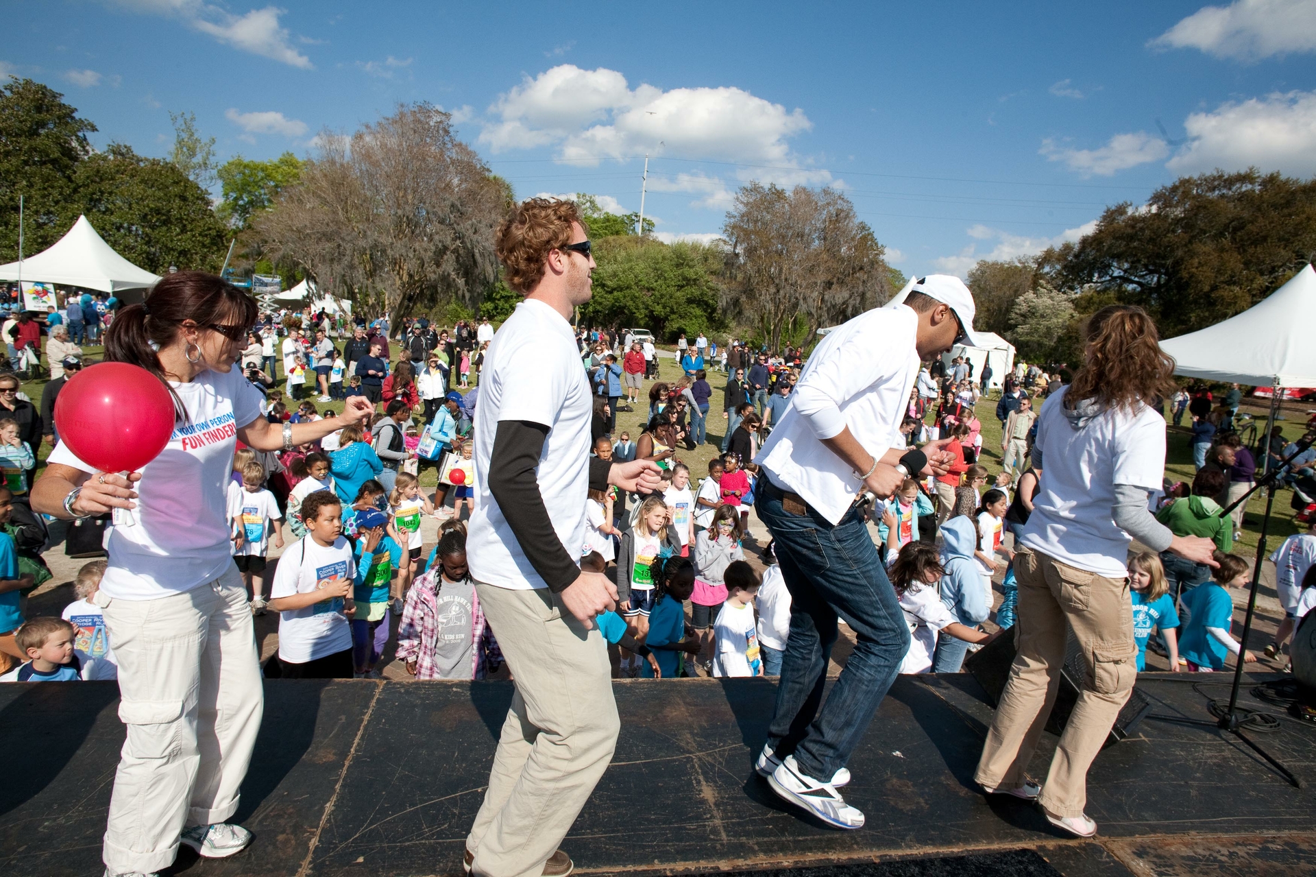 Carnival Cruise Director Malcolm Burn and the Fun Ambassadors warm up the crowd with a pre-race dance. 