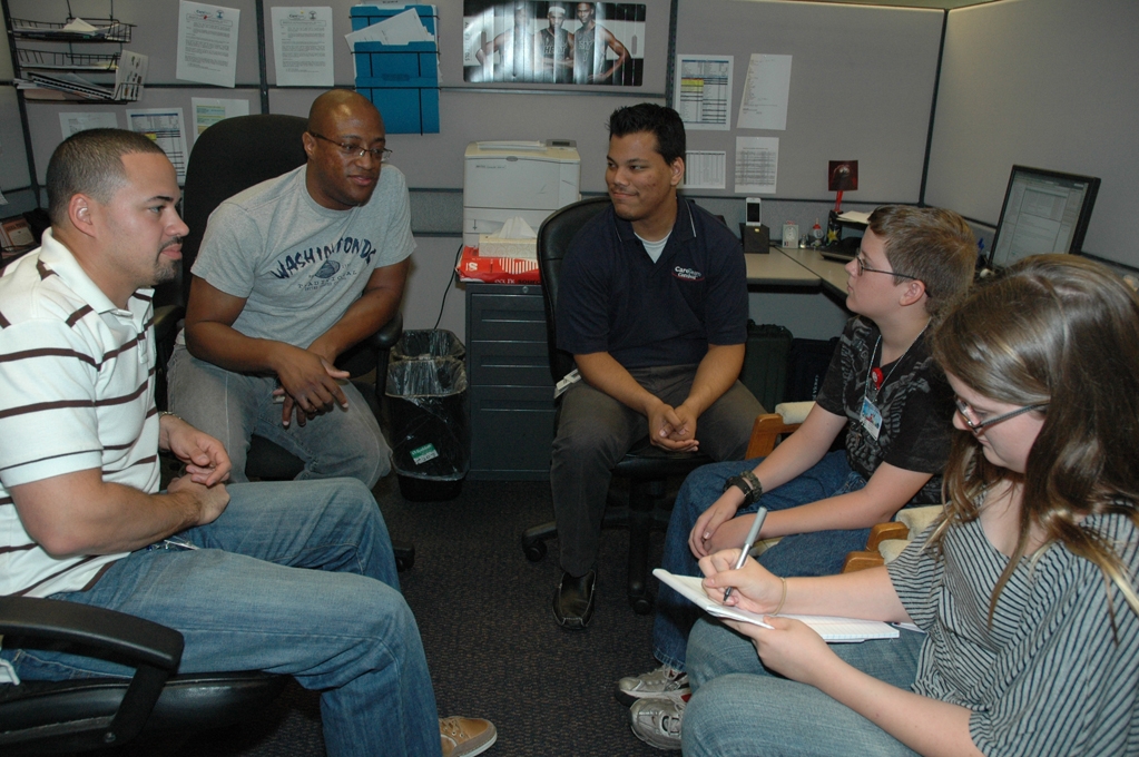 Kids participating in "Take Your Child to Work Day” interview various employees to learn more about their daily duties at Carnival Cruise Lines. 