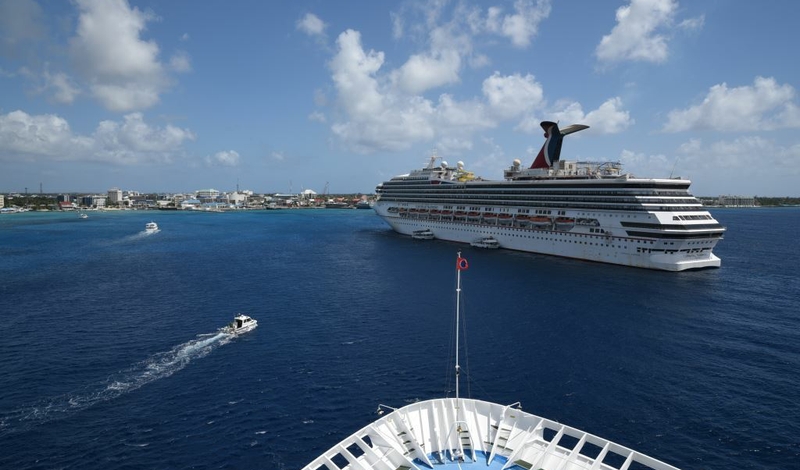 As part of Carnival Cruise Line’s successful return to guest operations, Carnival Paradise and Carnival Sunrise arrived in Grand Cayman, Cayman Islands today, marking the line’s first time back to the port since resuming service.
