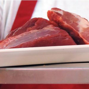 Steaks being weighed