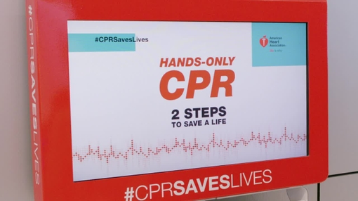 CPR Kiosk - Traveler practicing in airport